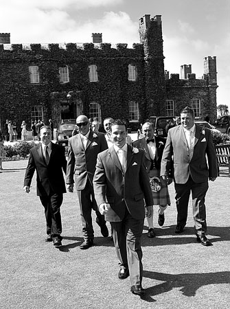 Photographer St Ives Cornwall groom walks towards camera